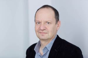 Portrait of the author by John Reynolds, courtesy of the publisher.